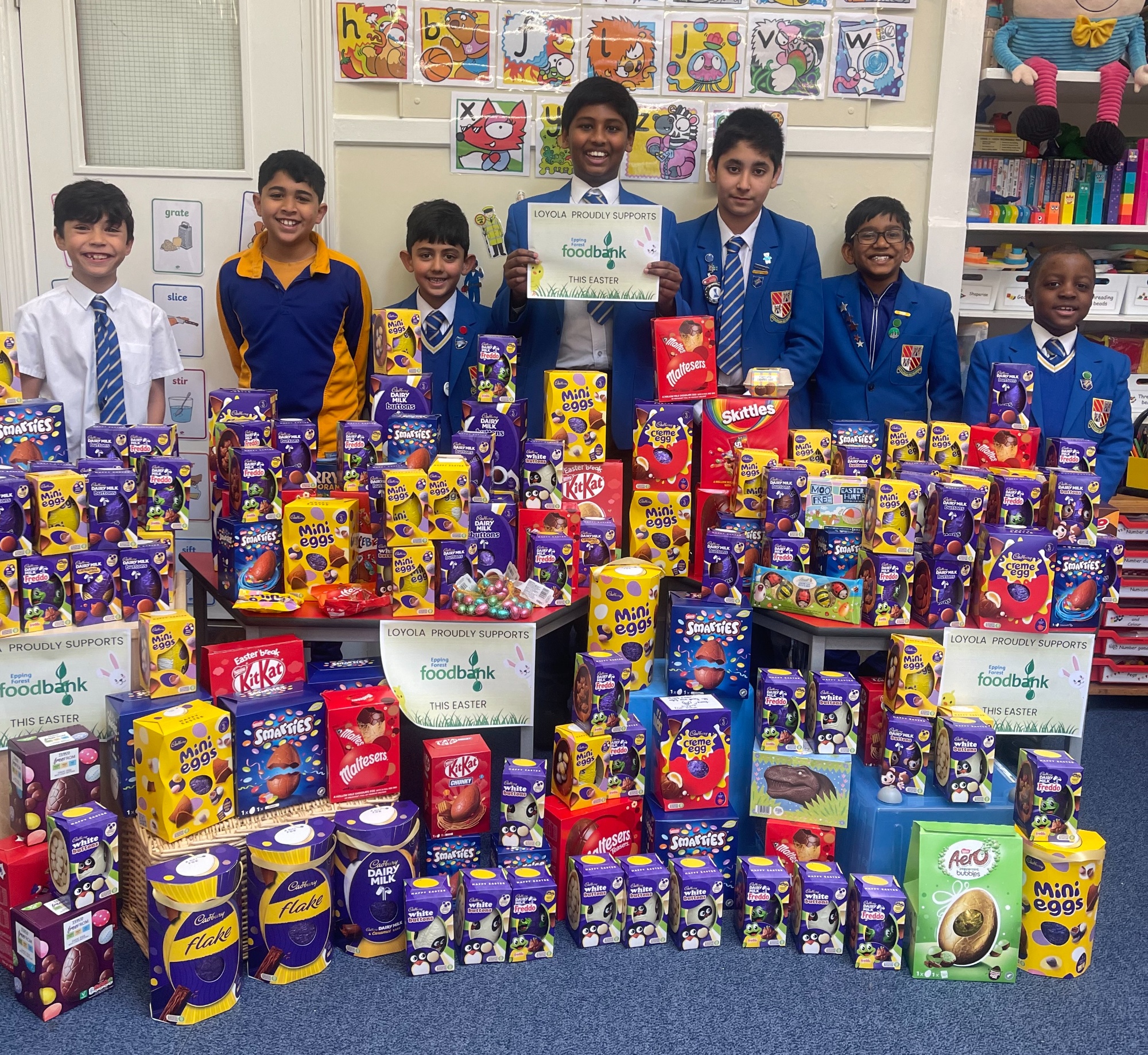 Loyola boys with food bank donations