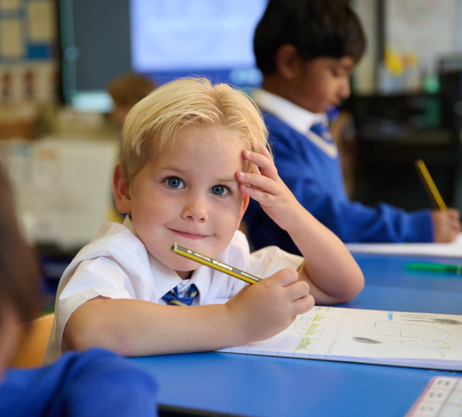 Reception Loyola boy writing